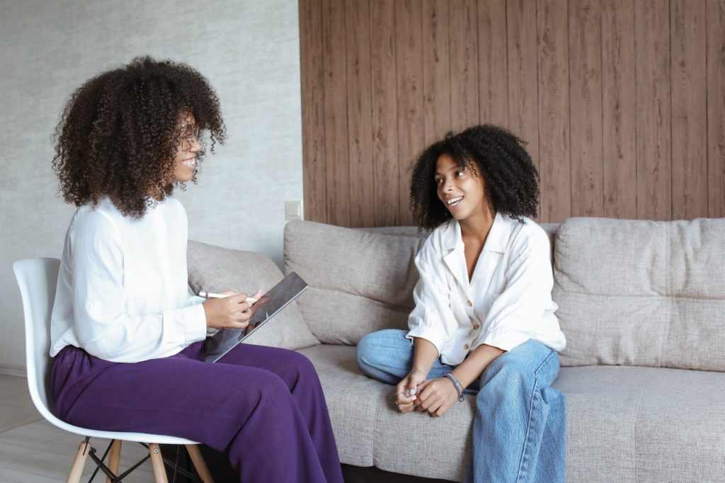 Woman participating in holistic rehab with a licensed practitioner 