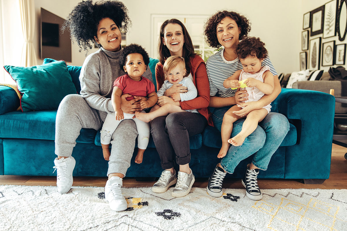 Women holding children