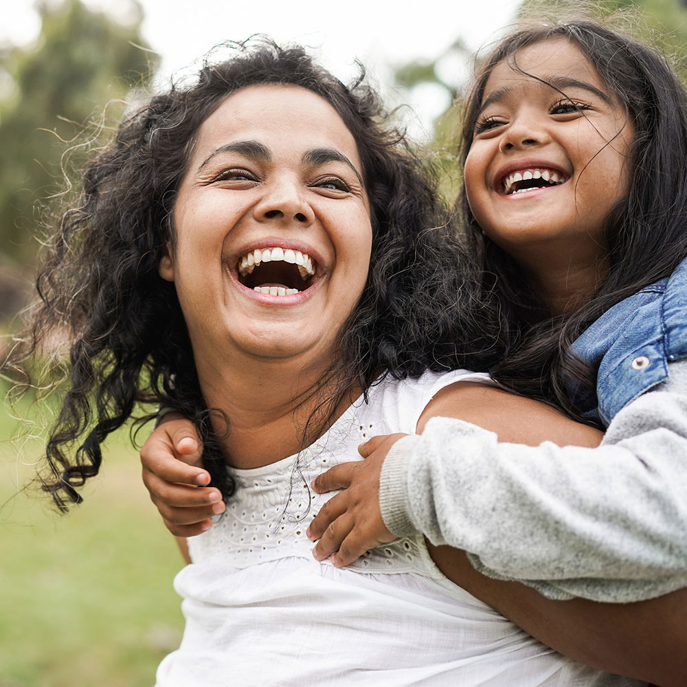 Woman laughing with her young daughter