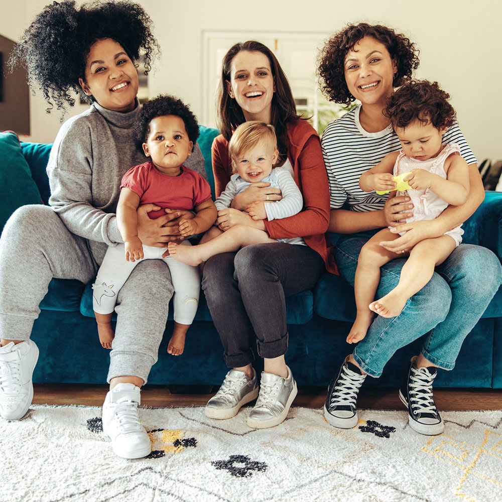 Women holding children